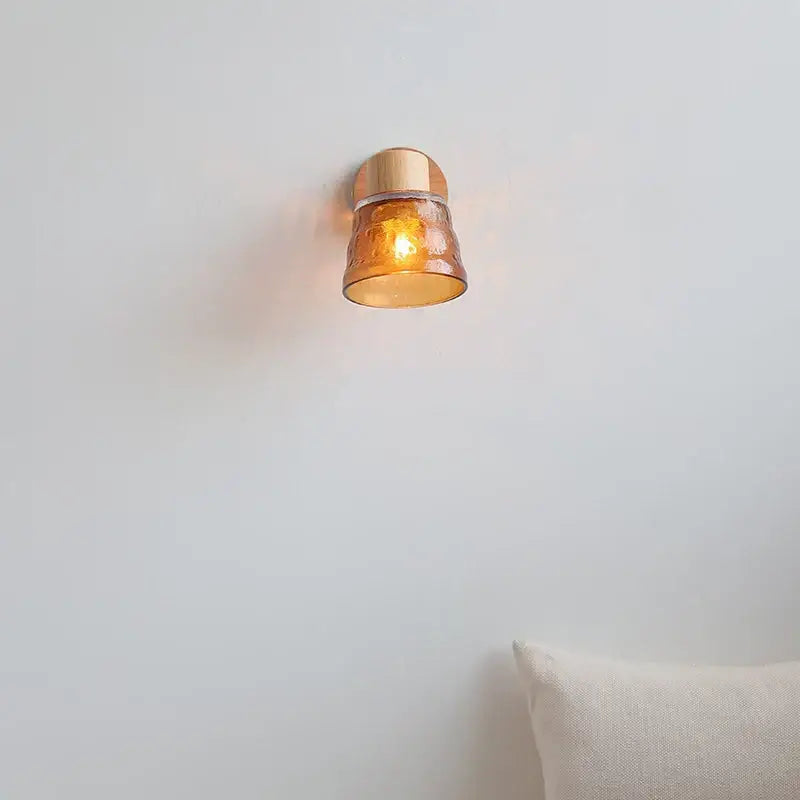 Modern wood and amber glass led wall sconce with warm amber glass and copper finished metal base for bedroom decorbites amber glass
