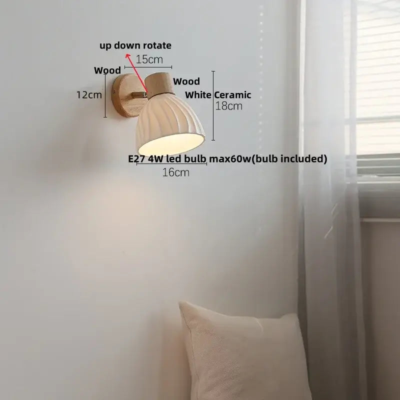 A warm-toned modern wall sconce with ribbed white shade and natural wood bracket featuring decorbites amber glass led design