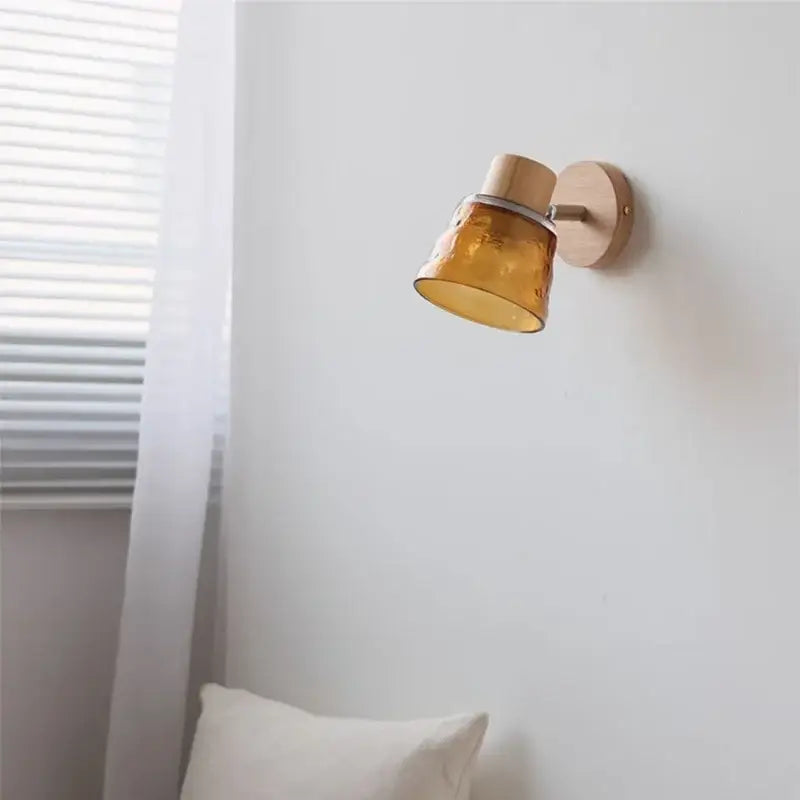 Modern wood and amber glass led wall sconce with decorbites amber glass and wooden base for bedroom decor