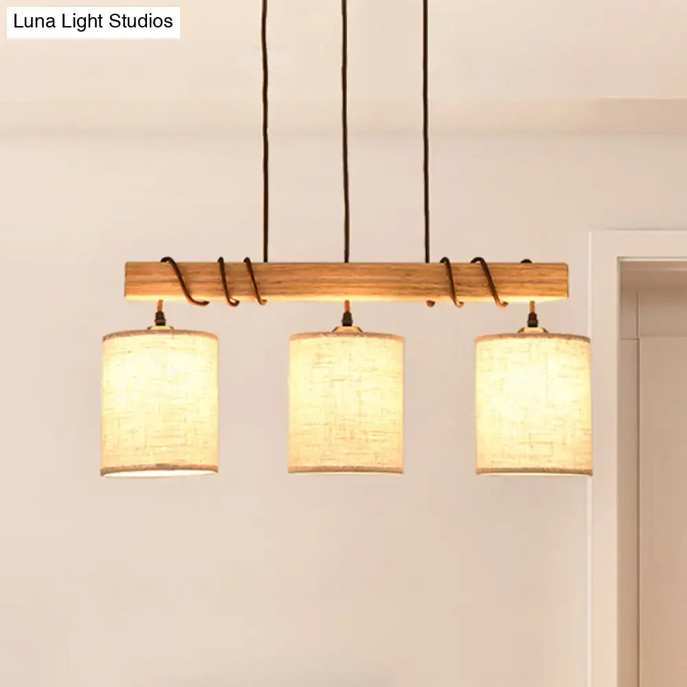Modern wood and beige fabric island lighting fixture with warm-toned shades and black cords for 220v-240v 110v-120v use