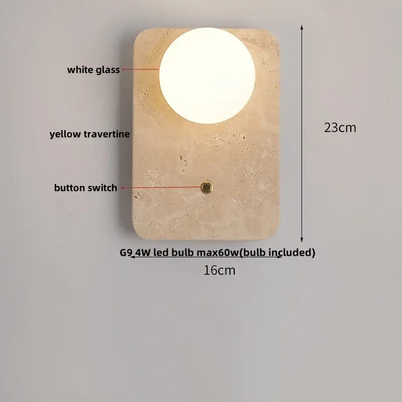 Modern wall light fixture with circular white glass lamp and yellow travertine base featuring brass button switch