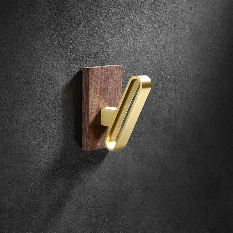 Modern wood and brushed gold wall hook with brushed gold metal hook on dark wood plaque for kitchen decorbites brass brushed design
