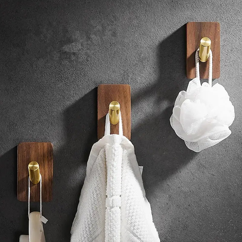 Modern wood and brushed gold wall hook row with brass brushed metal caps for kitchen decorbites use