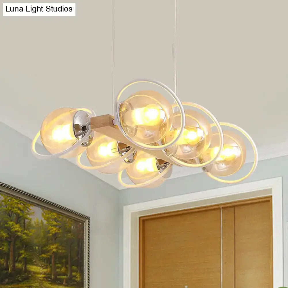 DecorBites™ modern chandelier with cognac bubble shade glass bulbs encased in chrome rings on wooden bar for shade island lighting