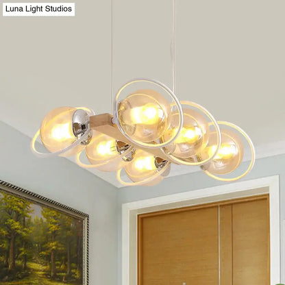 DecorBites™ modern chandelier with cognac bubble shade glass bulbs encased in chrome rings on wooden bar for shade island lighting