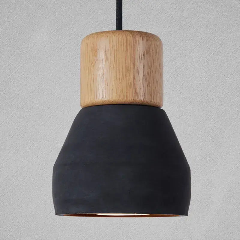 Modern wood and concrete pendant light with cylindrical natural wood top and matte black concrete pendant light shade