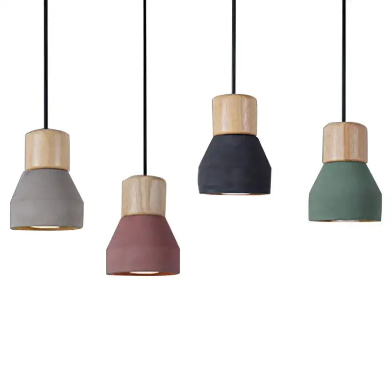 Modern wood and concrete pendant light with gray rose navy and sage concrete shades accented by natural wood collars