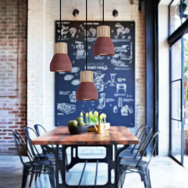 Three modern pendant light fixtures with terracotta ceramic shades and wood tops for rustic dining decorbites concrete pendant