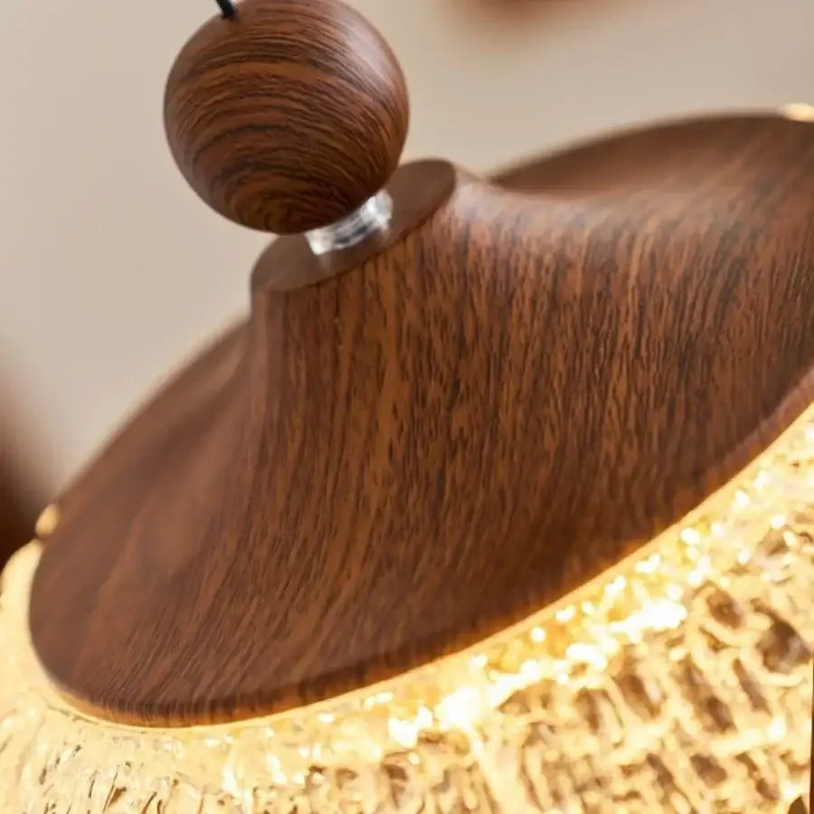 A warm-toned wooden pendant light with polished top and golden base for modern decorbites iceberg acrylic pendant lights
