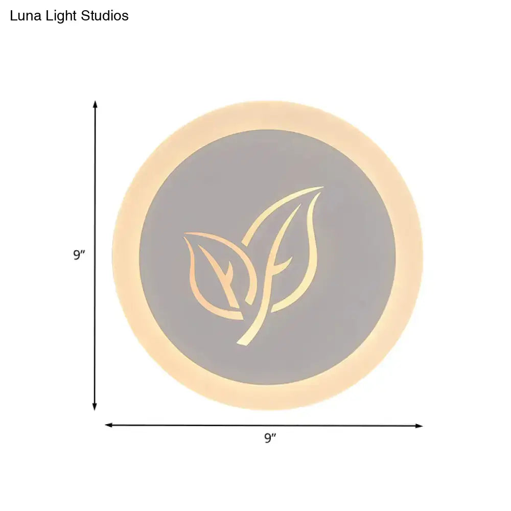 Modern wood and gray leaf wall lamp featuring a circular 9-inch led table lamp with warm glow and gold leaf logo