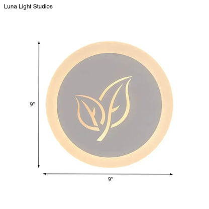 Modern wood and gray leaf wall lamp featuring a circular 9-inch led table lamp with warm glow and gold leaf logo