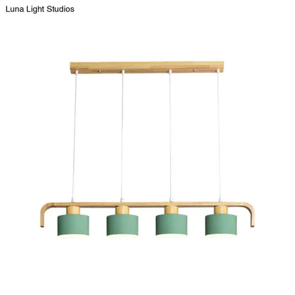 Modern wood and mint green 3 light chandelier with natural wood frame and matte sage green shades for dining room kitchen