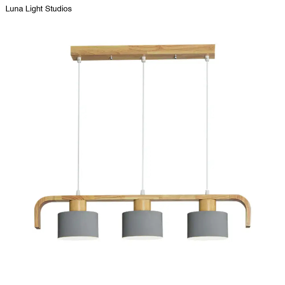 Modern three-light pendant lamp with light wood frame and matte gray shades for dining room kitchen lighting using led incandescent fluorescent bulbs