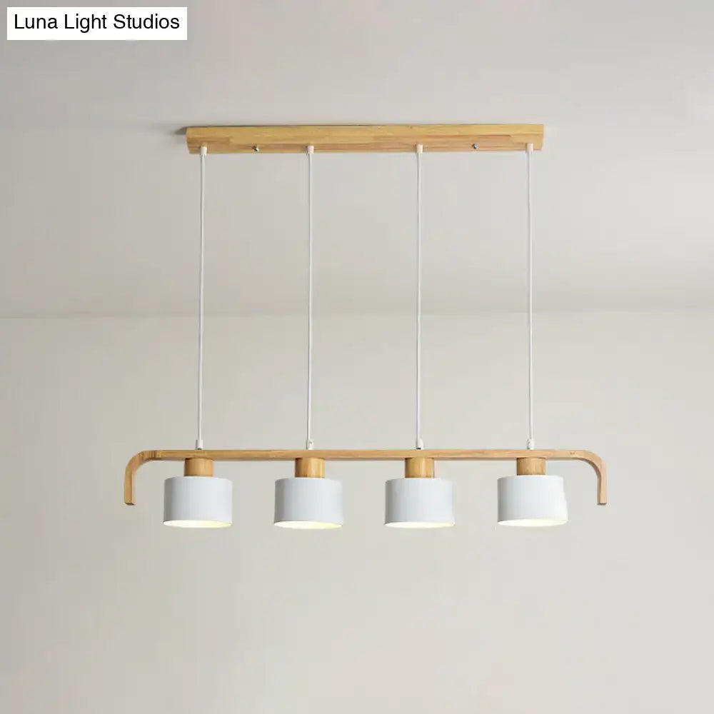 Minimalist modern wood pendant light with four white cylindrical shades for dining room kitchen LED incandescent fluorescent use