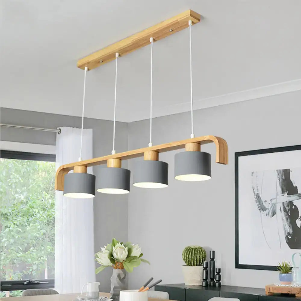 Modern wood and mint green 3 light chandelier with gray cylindrical shades and white cords for dining room kitchen use