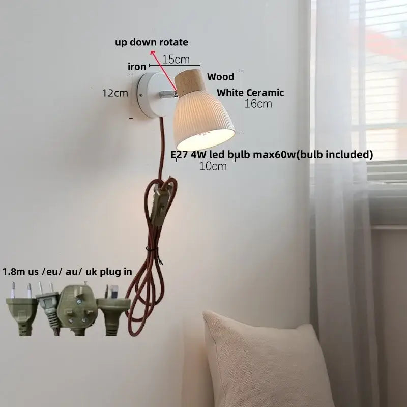 A modern wall light fixture with white ceramic shade wooden top cap and iron bracket for bedroom sconce use