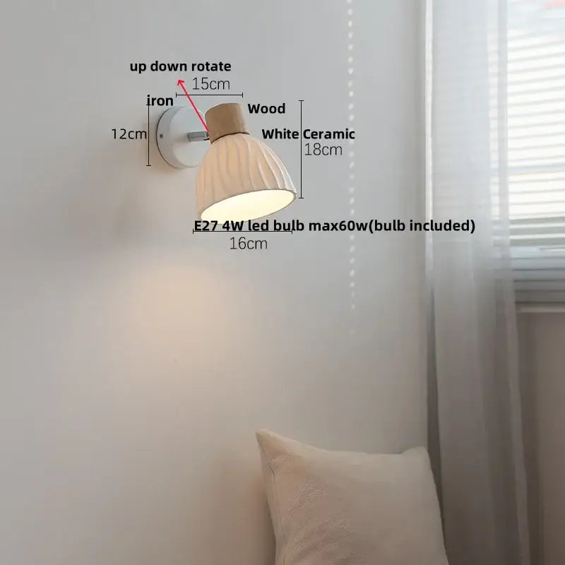 White ceramic wall light fixture with wooden top and iron mounting bracket for modern bedroom lighting