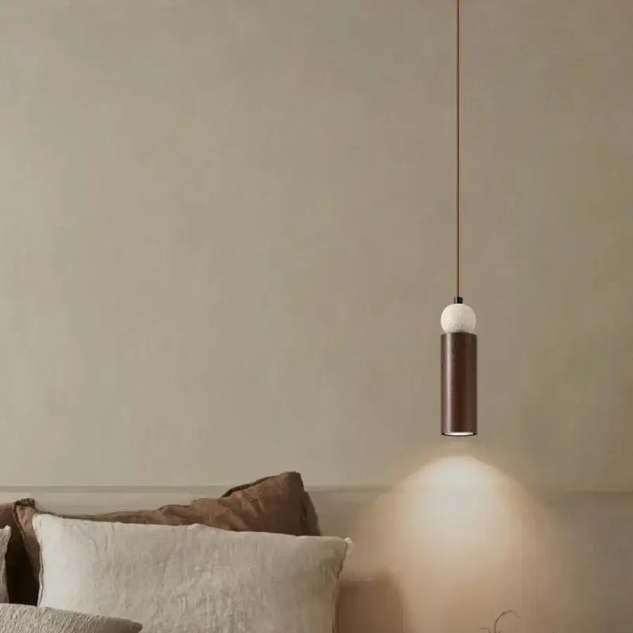 Modern wood and travertine iron led pendant light with matte bronze body and white marble sphere for living room decorbites iron led