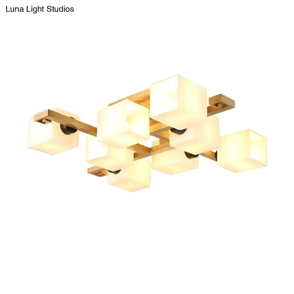 Modern geometric flush mount chandelier with warm white glass cubes and wood canopy for living room lighting by decorbites