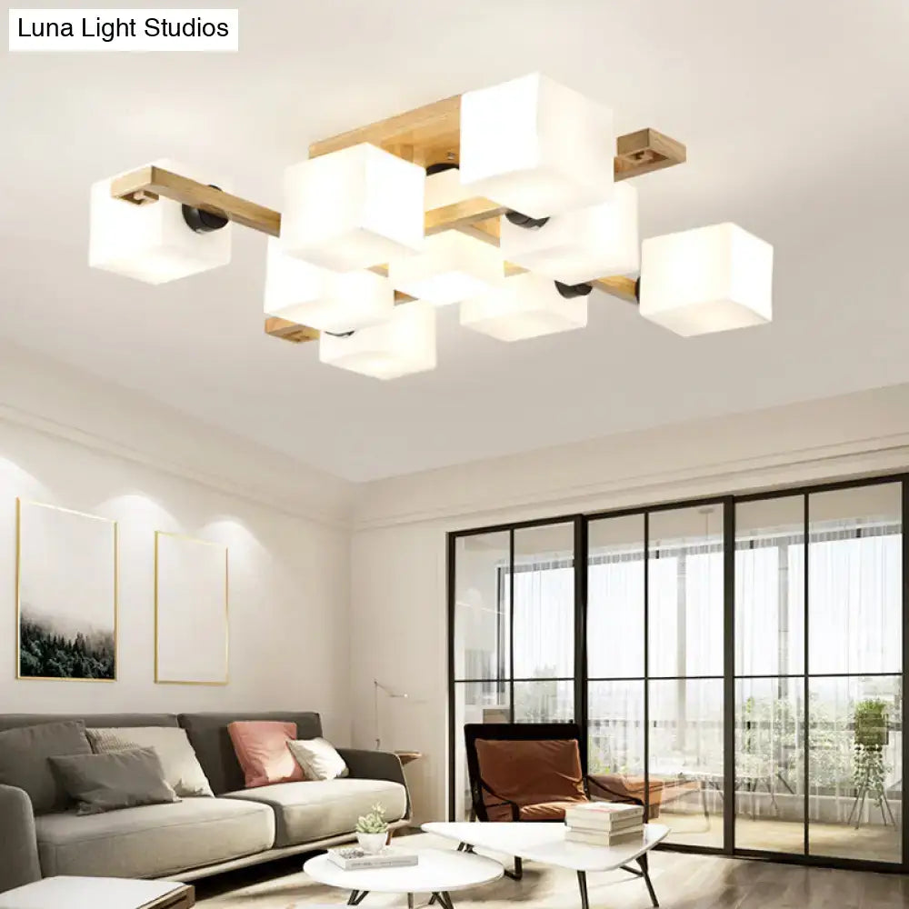 Modern rectangular pendant light with frosted white glass cubes and wood canopy for living room lighting by decorbites
