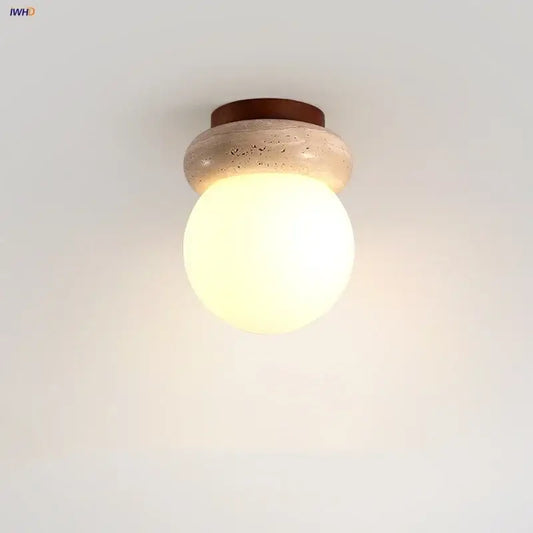 Modern wood base led ceiling light with warm-toned glass globe on beige stone base and dark brown wooden ring decorbites ceiling light