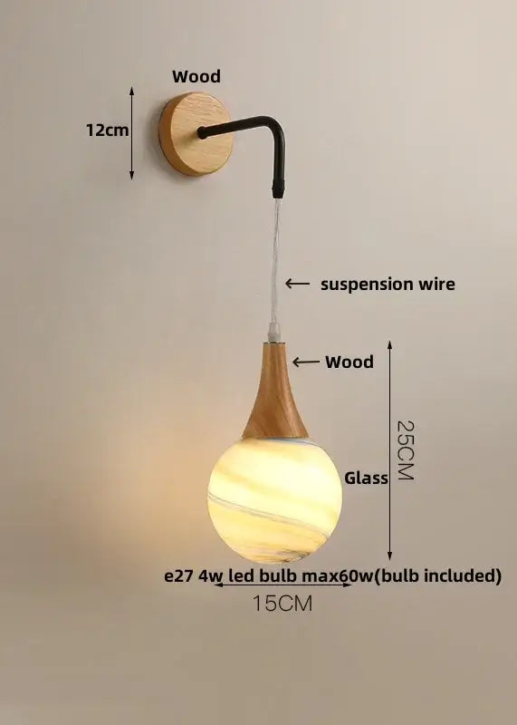 A warm amber-hued glass pendant lamp with wooden stem for modern cube led wall lights bedroom sconce