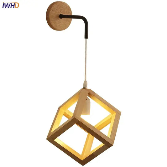 A warm-toned wooden cube led wall light with black curved arm and circular wood mounting plate for bedroom sconce