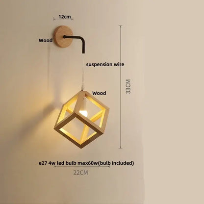 A warm-toned wooden cube led wall light with black metal arm and suspension wire for modern bedroom sconce lighting