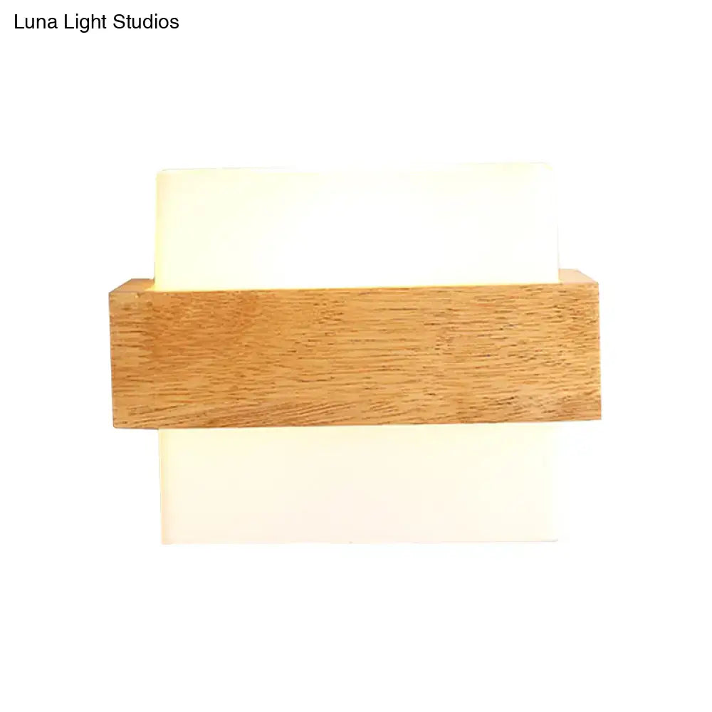 Minimalist modern wall lamp with warm wood deco milk frame and two off-white deco milk glass panels for bedroom use