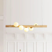 DecorBites modern wood island ceiling light with opal glass spherical shades and adjustable fixture height for dining room