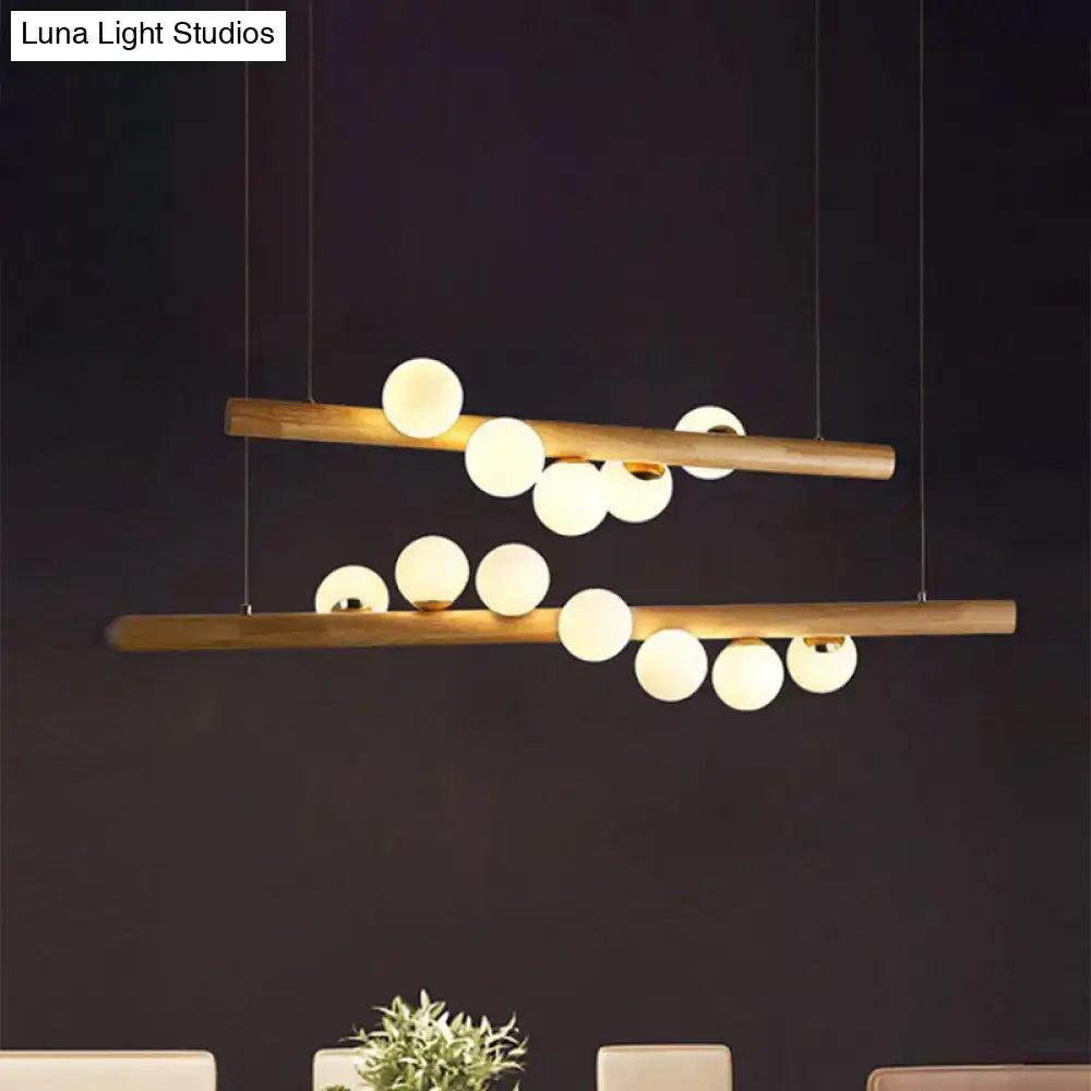 DecorBites modern wood island ceiling light with two horizontal bars and opal glass spherical bulbs for dining room