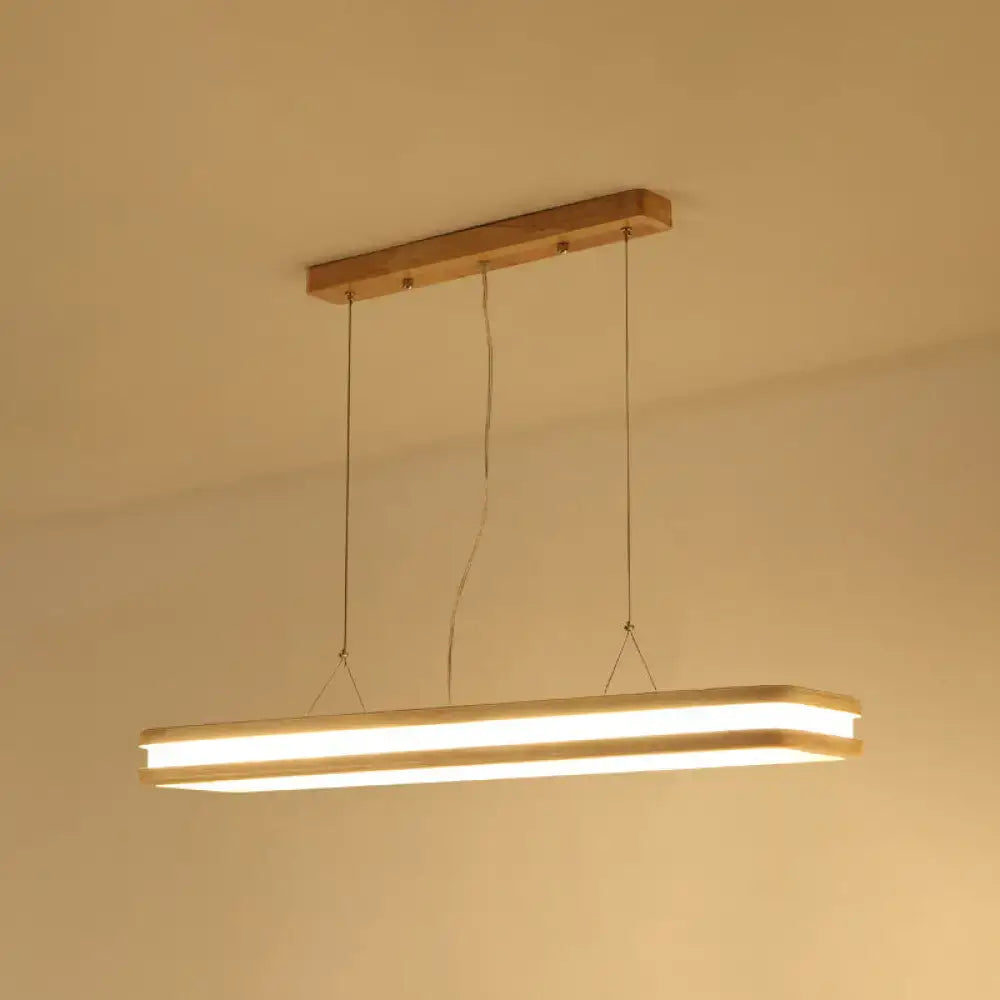 Modern wood rectangular hanging island lamp with warm glow natural wood frame and metal suspension cords for dining room