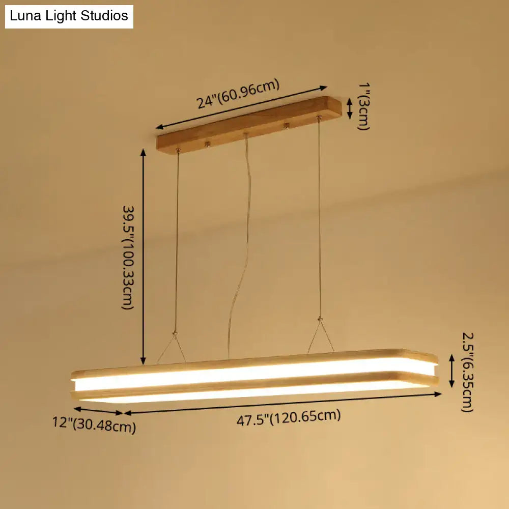 Modern wood rectangular hanging island lamp with warm glowing LED strip in minimalist wooden frame for dining room