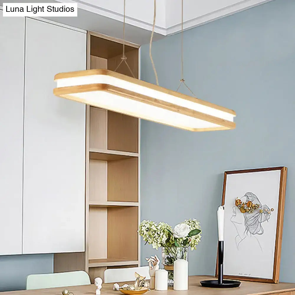 Modern wood rectangular hanging island lamp with warm wood frame and two glowing led strips for dining room lighting