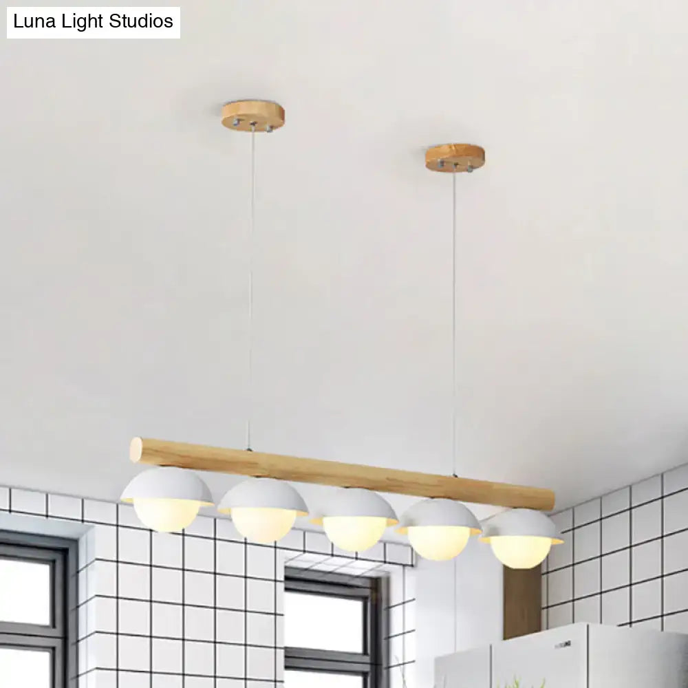 DecorBites modern wood stem linear chandelier with natural wood bar and five white shade dome lampshades suspended