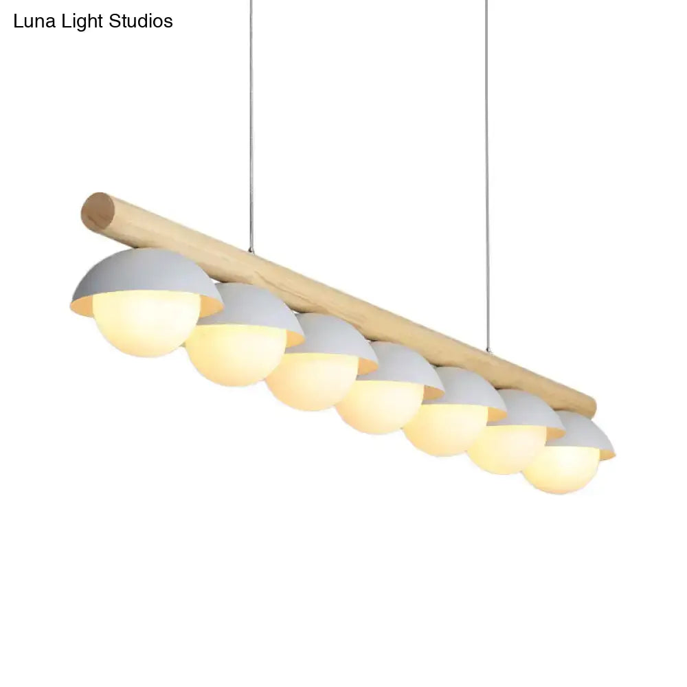 Decorbites modern wood stem linear chandelier with seven white shade dome lights emitting warm illumination
