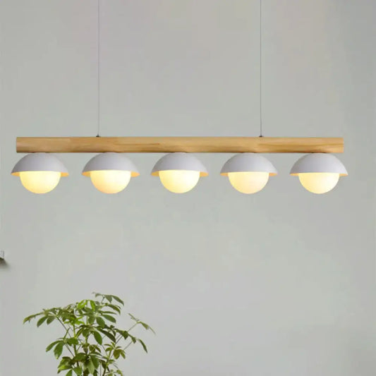 DecorBites modern wood stem linear chandelier with five white shade pendant lights emitting warm illumination