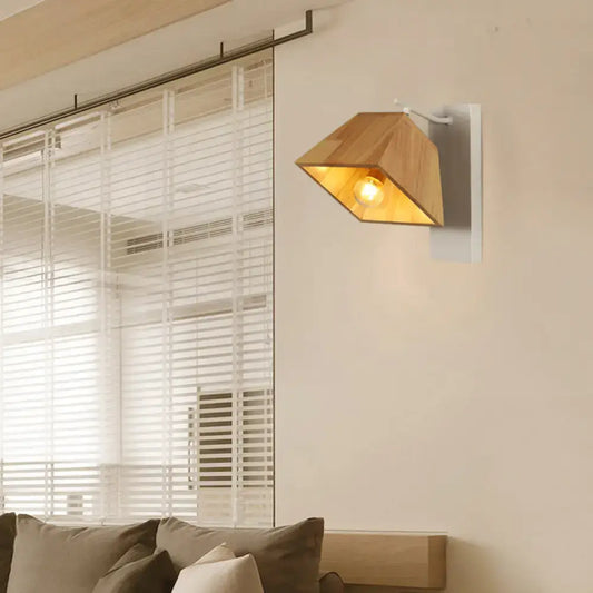Modern wood trapezoid wall sconce with direct wired white metal bracket and illuminated light wood fixture height design
