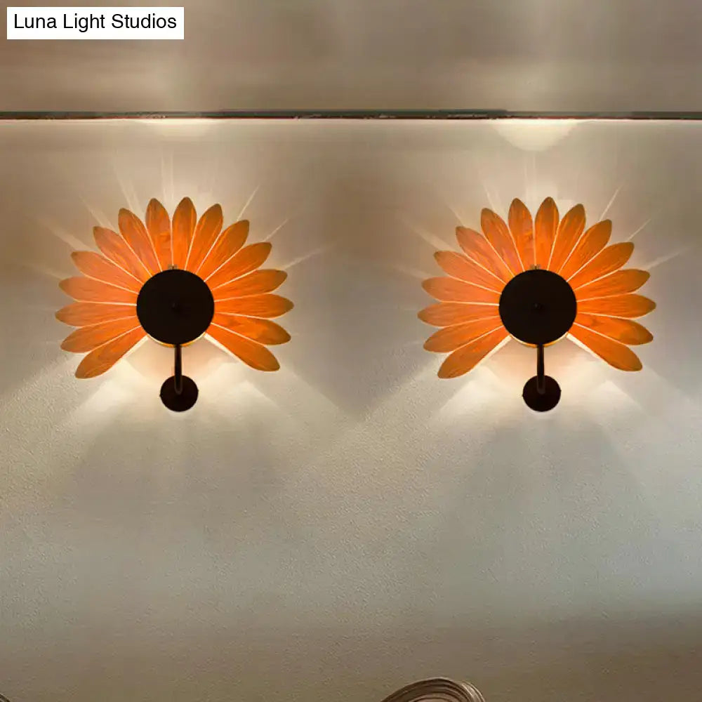 Modern wood veneer orange sunflower-shaped wall sconce with black metal center and e26 e27 bulb base hanging accents