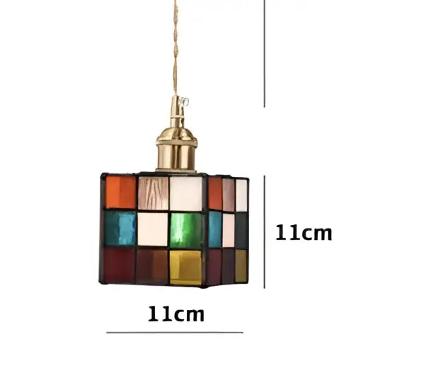 A colorful square stained glass pendant light with brass finish and chain complements decorbites led wall sconce design