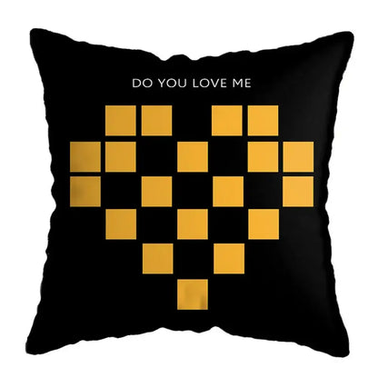 Black throw pillow with pixelated gold heart and do you love me text in modern geometric deer print design