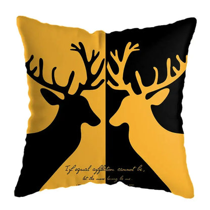 Modern yellow and black geometric deer print throw pillow with two deer silhouettes and elegant script for living room decor