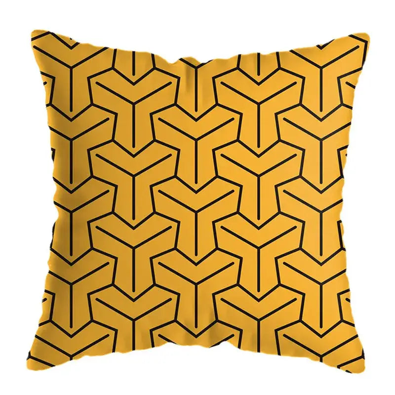 Modern yellow and black geometric deer print throw pillow with bold 3d-like interconnected lines on vibrant fabric