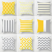 A collection of nine decorbites geometric stripe throw pillows in yellow gray and white for modern living room decor