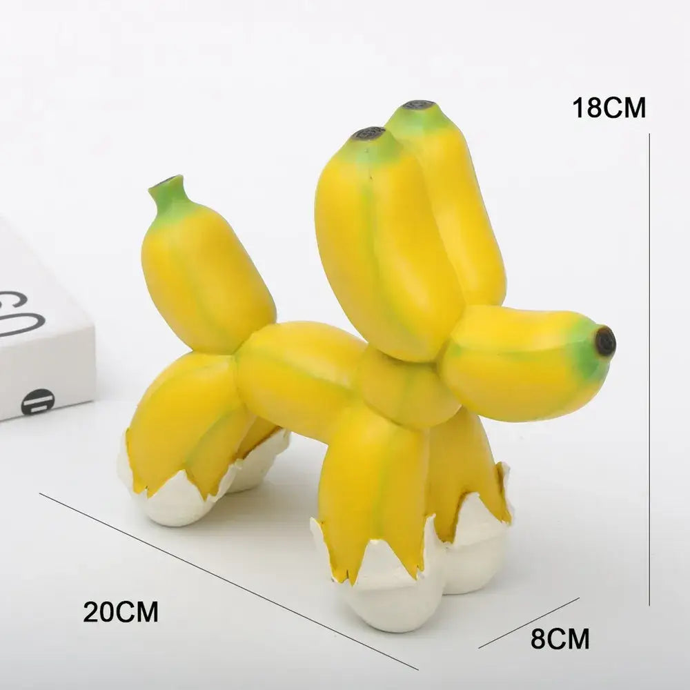 Modern yellow banana balloon dog sculpture with green tips and white eggshell feet for living room pop art decor