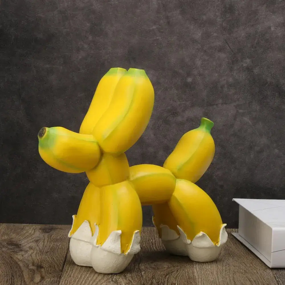 Modern yellow banana balloon dog sculpture with green tips and white egg-like feet for living room pop art decor