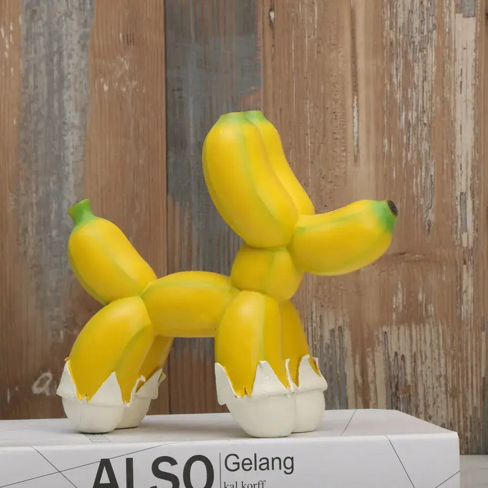 Modern yellow banana balloon dog sculpture with white eggshell feet for living room pop art decor