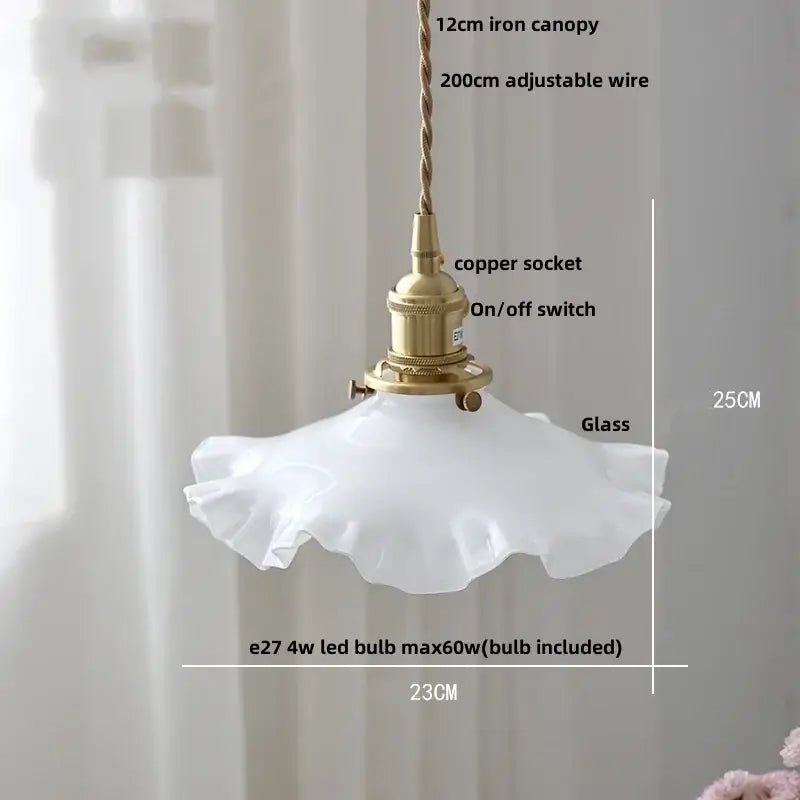Modern white glass pendant light with ruffled translucent shade and brass hardware featuring decorbites copper knob design