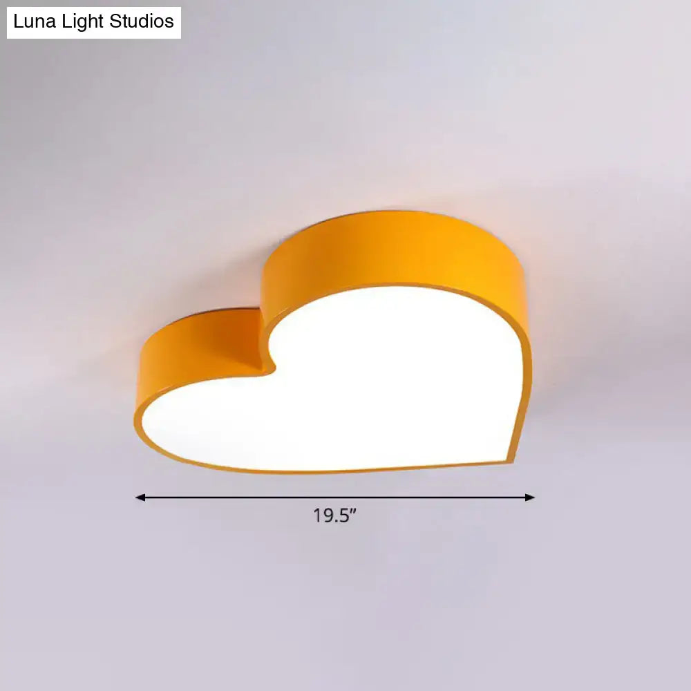 A bright yellow decorbites™ cartoon loving heart led flush mount ceiling light with romantic acrylic design