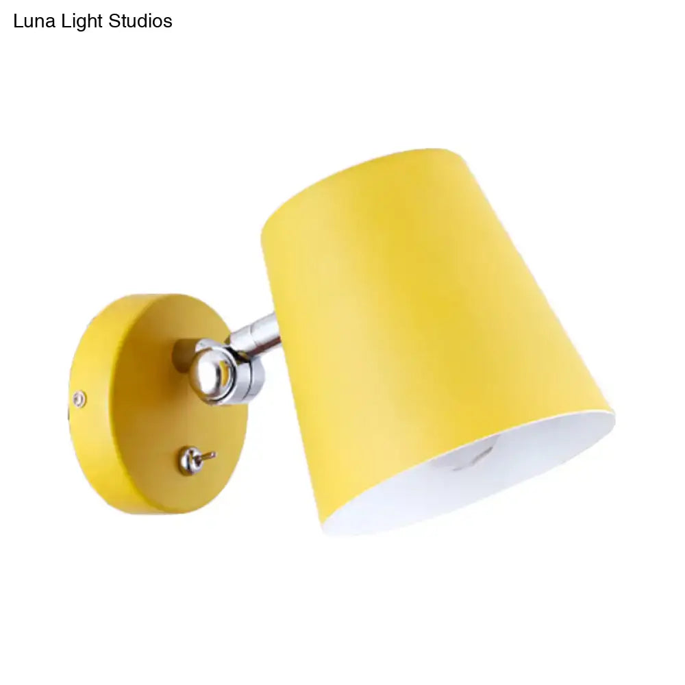 Modern yellow conical sconce light with metal shade matte finish and chrome hardware for bedroom use